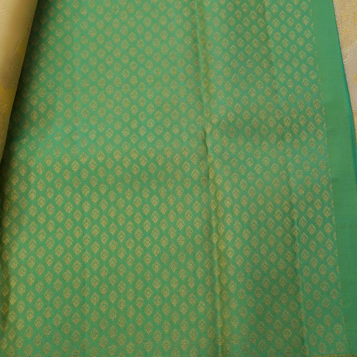 Kanchipuram Cream and Mustard Yellow Silk Saree with Contrast Green Zari Border