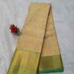 Kanchipuram Cream and Mustard Yellow Silk Saree with Contrast Green Zari Border