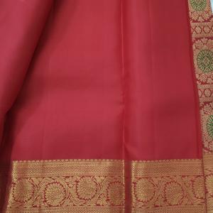 Kanchipuram Crimson Red Silk Saree with Traditional Gold Zari Borders and Meenakari Accents