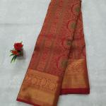 Kanchipuram Crimson Red Silk Saree with Traditional Gold Zari Borders and Meenakari Accents