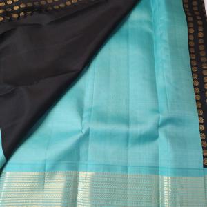 Jet Black Silk Saree with All-Over Gold Coin Buttas & Contrast Sea Green Border
