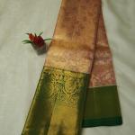 Peach-Pink Tissue Silk Saree with All-Over Gold Zari Jaal & Contrast Bottle Green Border