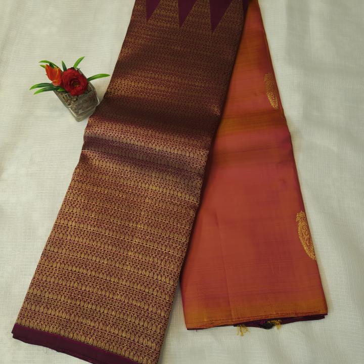 Sunset Peach Silk Saree with Paisley Motifs & Contrast Plum Zari Pallu