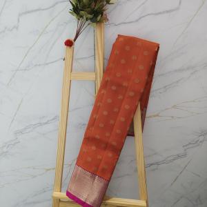 Rust Orange Silk Saree with All-Over Gold Zari Buttas & Contrast Magenta Border